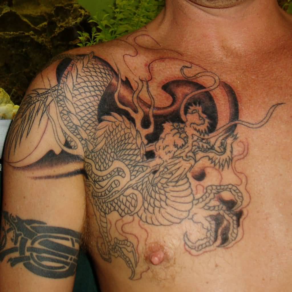 Awesome Black Ink Dragon Tattoo On Man Right Front Shoulder