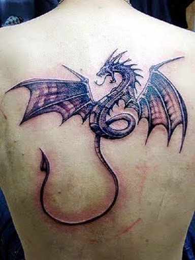 Awesome Black Ink Dragon Tattoo On Man Upper Back