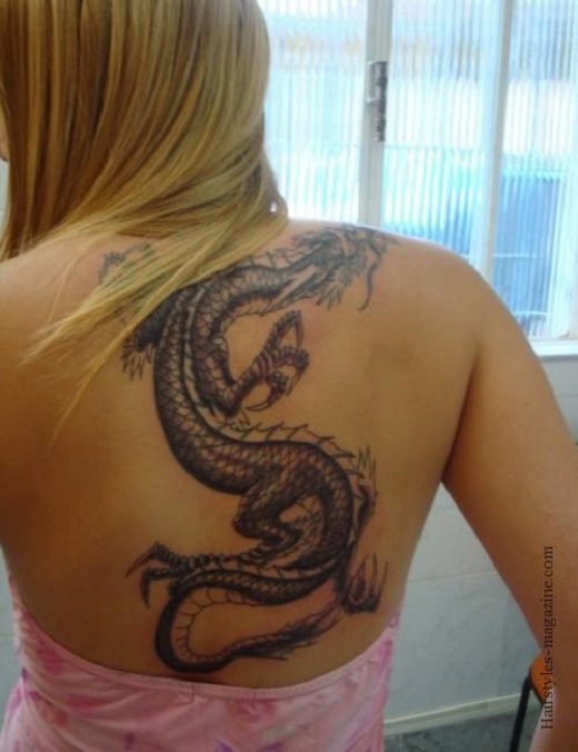 Awesome Black Ink Dragon Tattoo On Women Upper Back