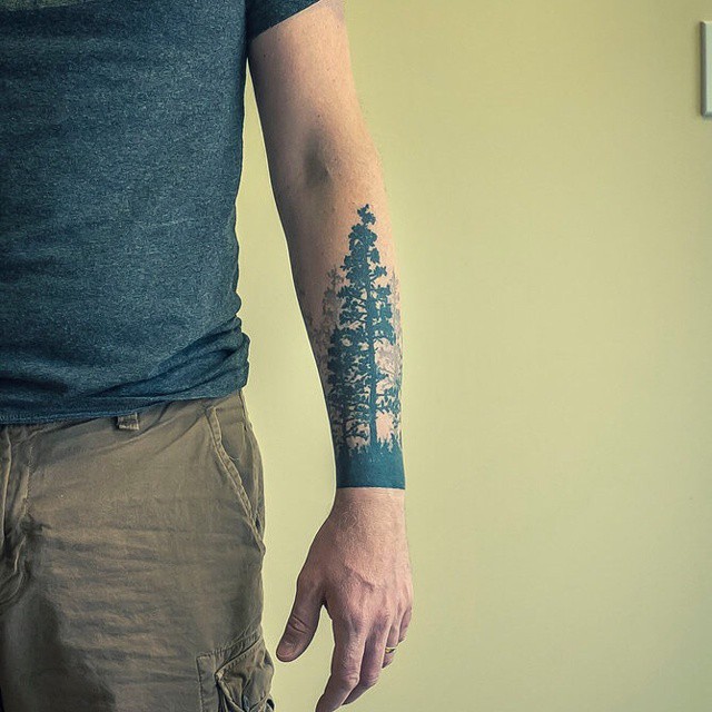 Awesome Black Ink Pine Tree Tattoo On Left Arm