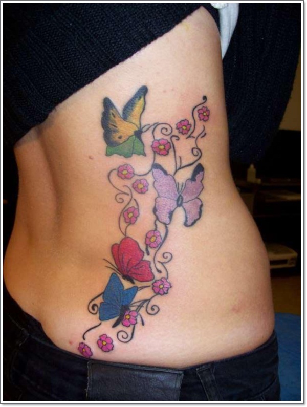 Awesome Colored Butterflies And Flowers Tattoo On Back