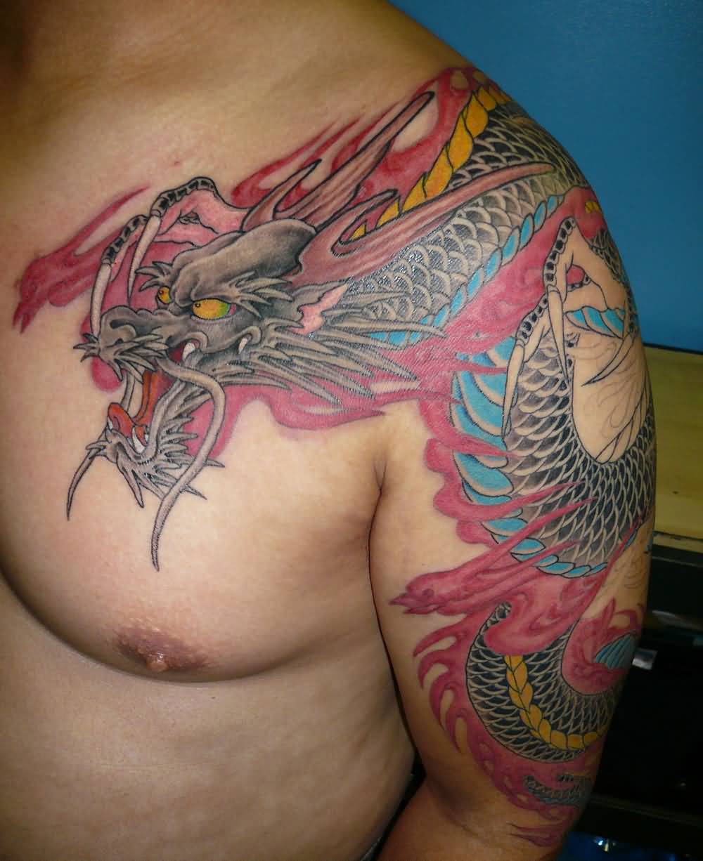 Awesome Colorful Dragon Tattoo On Man Left Shoulder