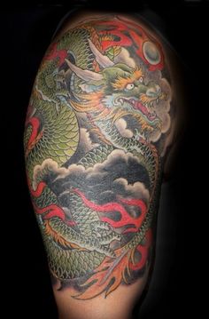 Awesome Colorful Traditional Dragon Tattoo On Right Half Sleeve By Andrea