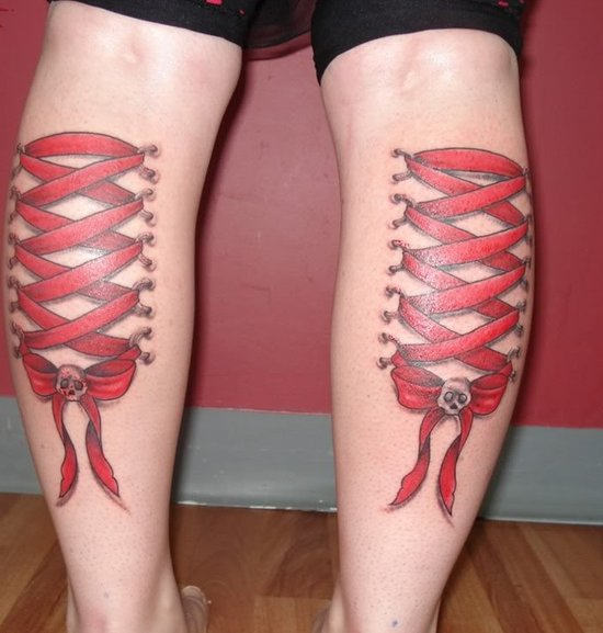 Awesome Red Ink Corset With Bow And Skull Tattoo On Both Leg Calf