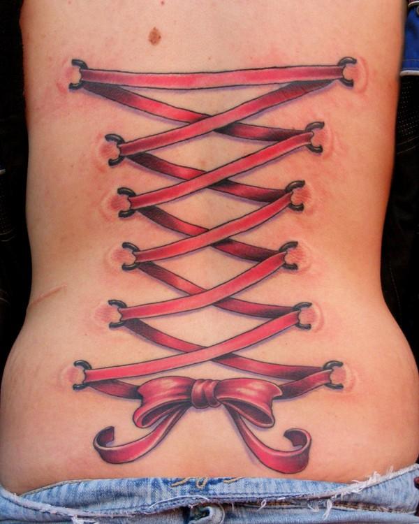Awesome Red Ink Corset With Bow Tattoo On Lower Back