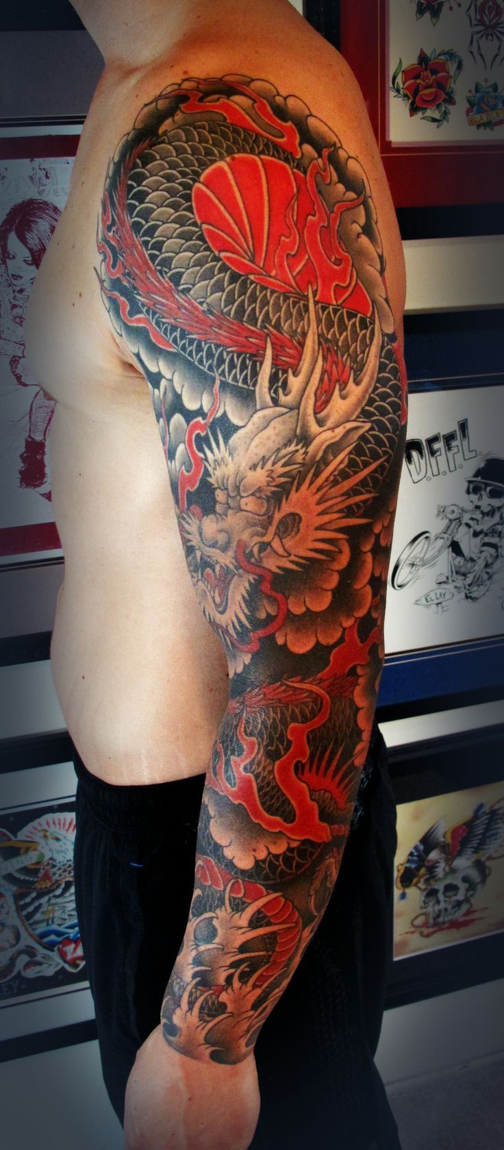 Awesome Traditional Dragon Tattoo On Man Left Full Sleeve
