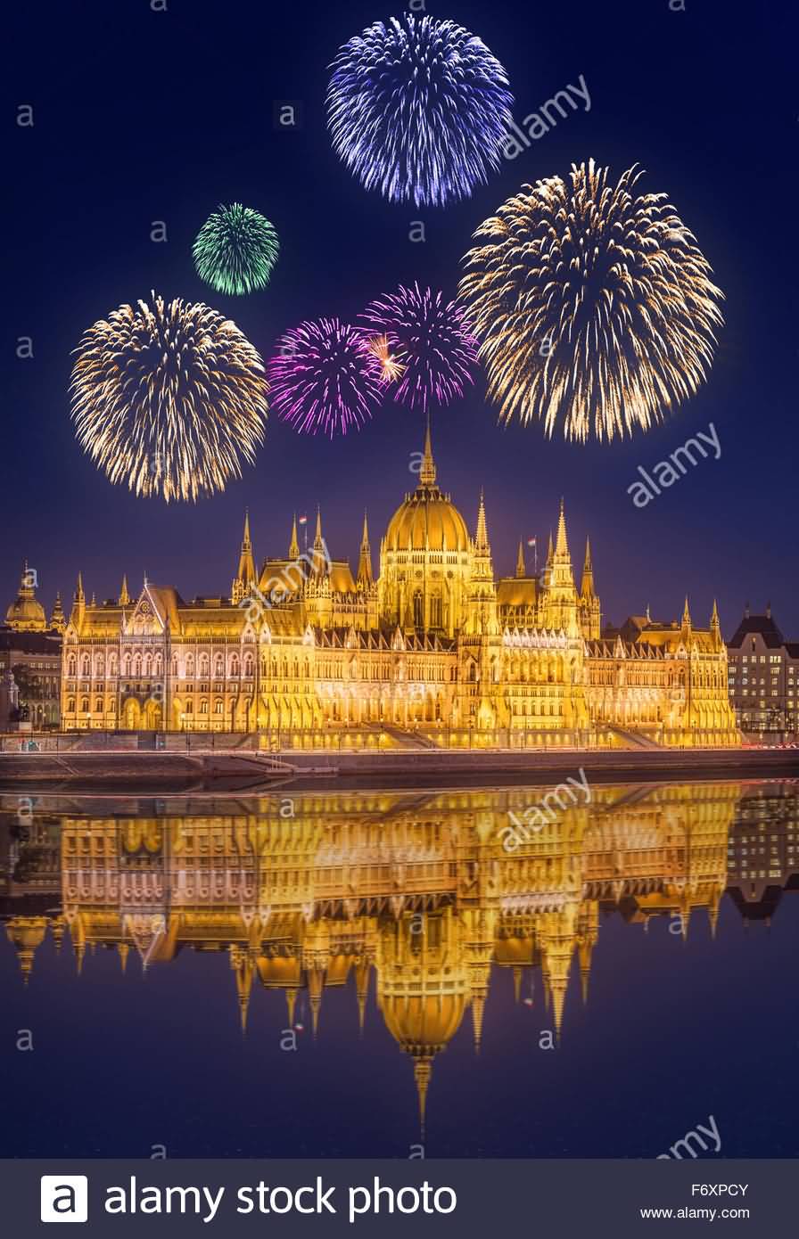 Beautiful Fireworks Under Hungarian Parliament Building At Night In Budapest, Hungary