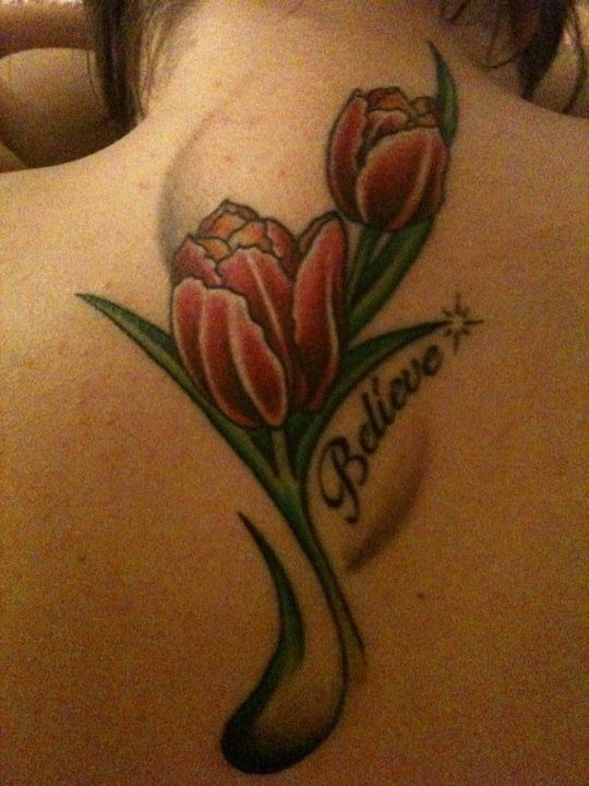 Believe Tulip Tattoo On Girl Upper Back