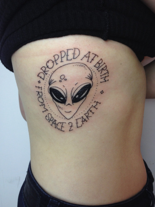 Black Alien Head Tattoo On Right Side Rib