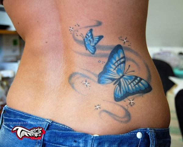 Black And Blue Butterfly Tattoos On Girl Lower Back