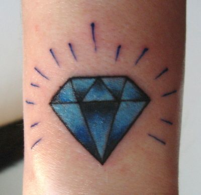 Black And Blue Diamond Tattoo On Arm