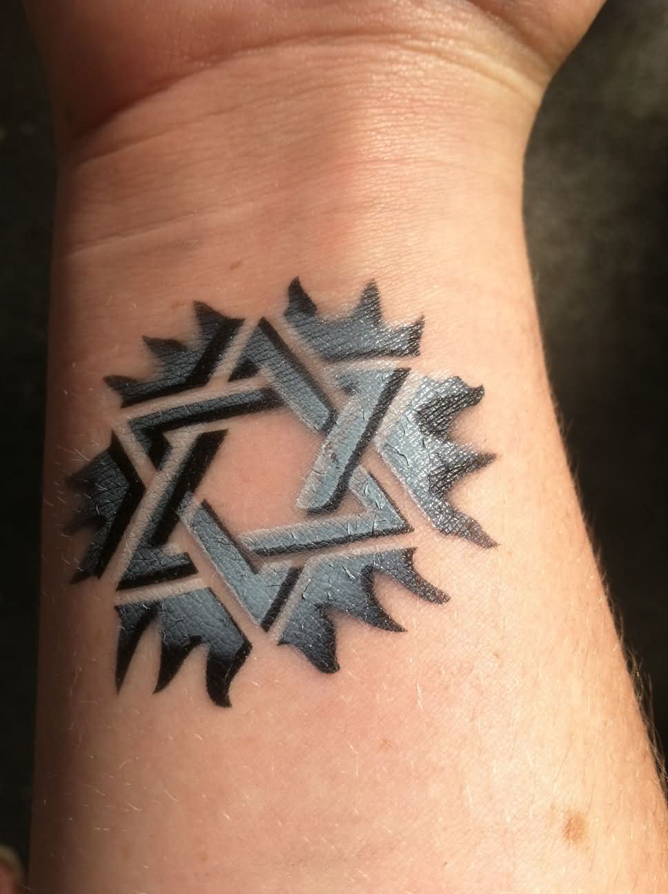 Black And Grey 3D Penrose Star Tattoo On Wrist