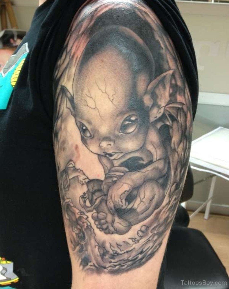 Black And Grey Alien Baby Tattoo On Left Half Sleeve