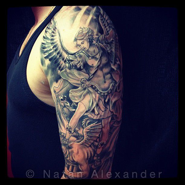 Black And Grey Archangel Michael Tattoo On Man Left Half Sleeve