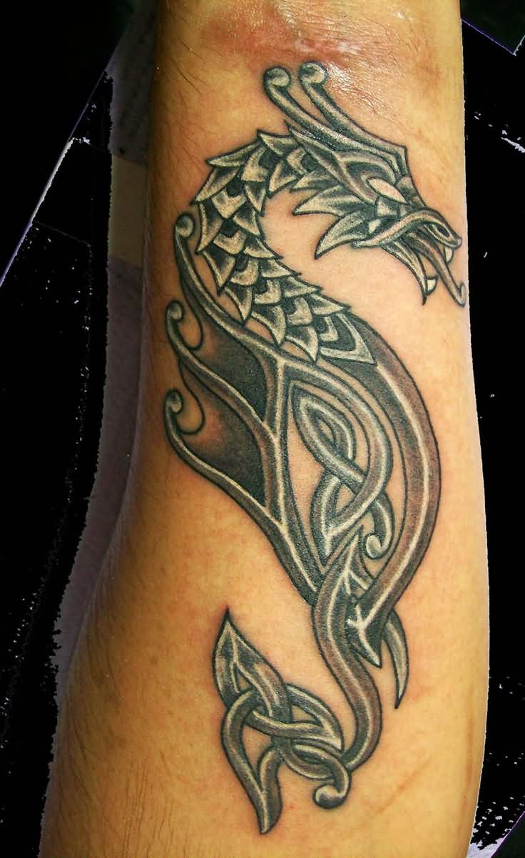 Black And Grey Celtic Dragon Tattoo On Sleeve