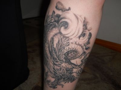 Black And Grey Dragon Tattoo Design For Leg