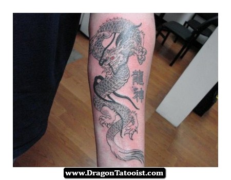 Black And Grey Dragon Tattoo On Left Forearm