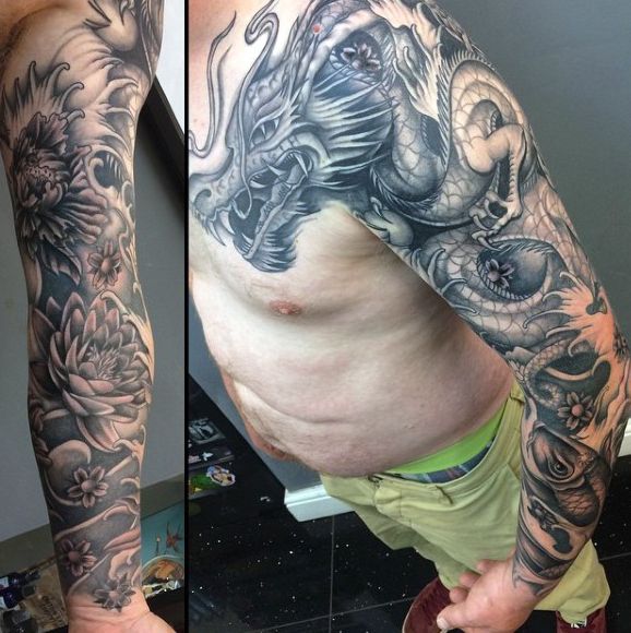 Black And Grey Dragon Tattoo On Man Left Full Sleeve