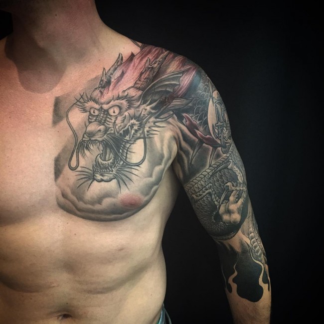 Black And Grey Dragon Tattoo On Man Left Half Sleeve And Chest