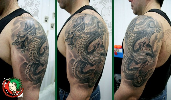 Black And Grey Dragon Tattoo On Man Left Half Sleeve