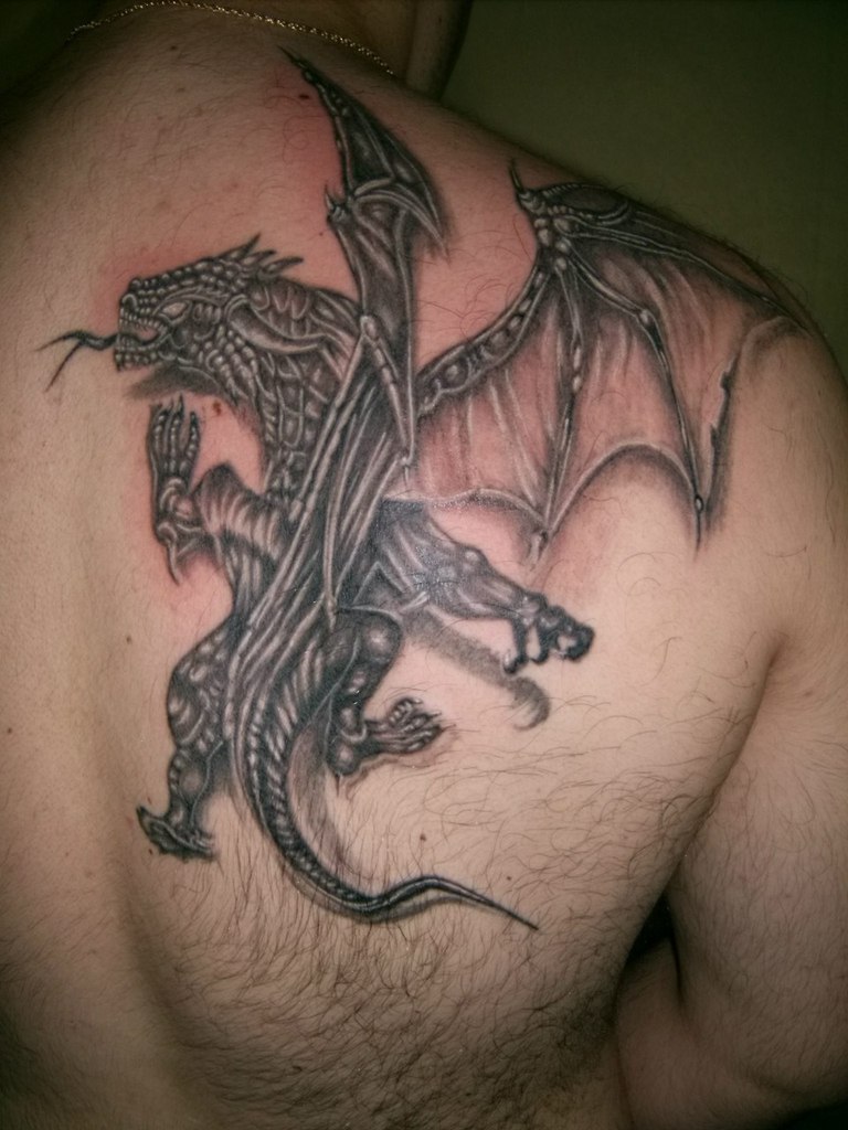 Black And Grey Dragon Tattoo On Right Back Shoulder
