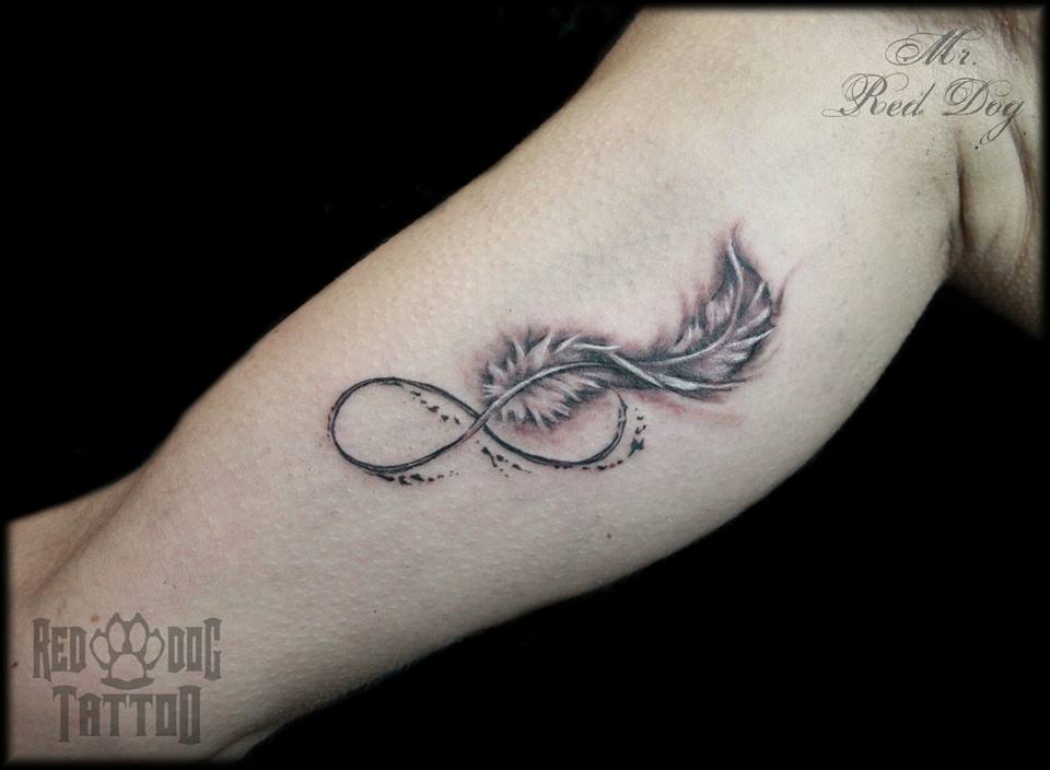 Black And Grey Feather Tattoo On Bicep