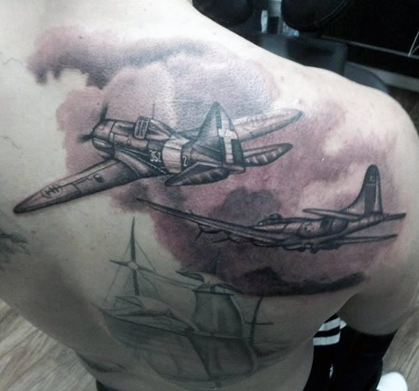 Black And Grey Flying Airplanes Tattoo On Man Right Back Shoulder