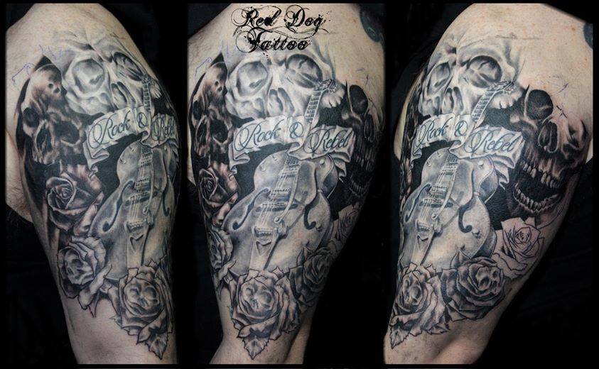 Black And Grey Guitar With Skull And Roses Tattoo On Half Sleeve