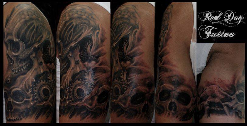 Black And Grey Skulls Tattoo On Left Half Sleeve