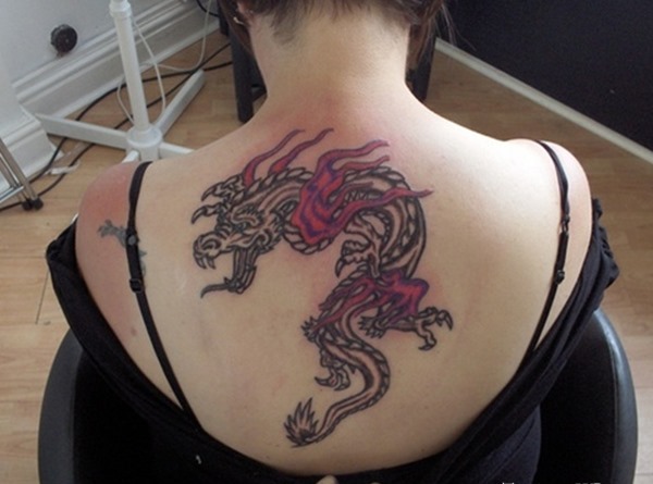 Black And Pink Dragon Tattoo On Women Upper Back