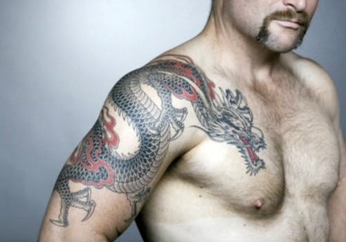 Black And Red Dragon Tattoo On Man Right Shoulder