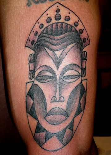 Black Ink African Mask Tattoo Design For Thigh