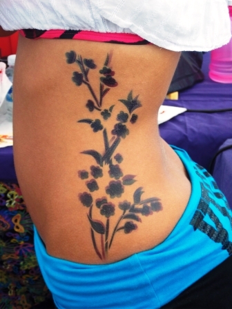 Black Ink Airbrush Flowers Tattoo On Left Side Rib
