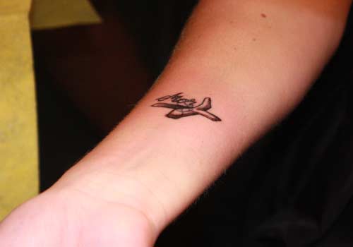 Black Ink Airplane Tattoo On Forearm