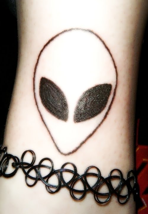Black Ink Alien Head Tattoo Design For Wrist