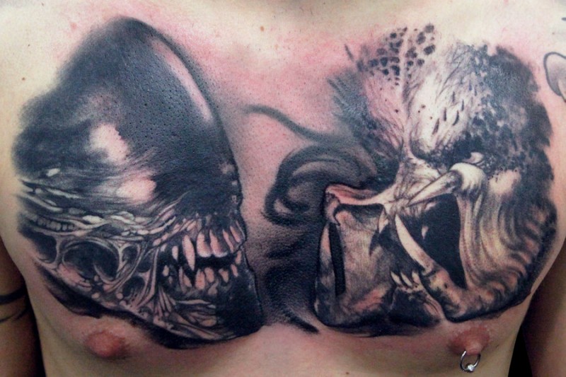 Black Ink Alien Head Tattoo On Man Chest