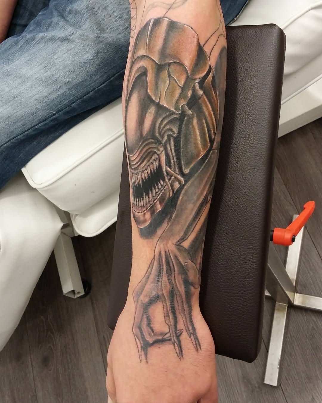 Black Ink Alien Tattoo On Left Arm