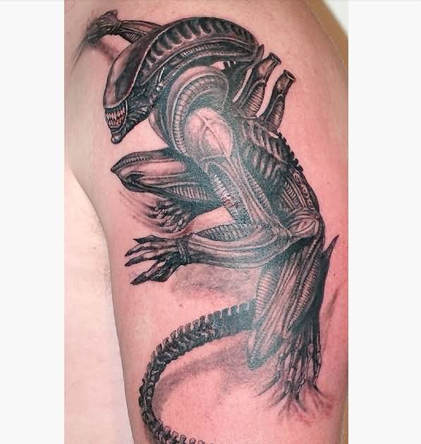 Black Ink Alien Tattoo On Left Shoulder