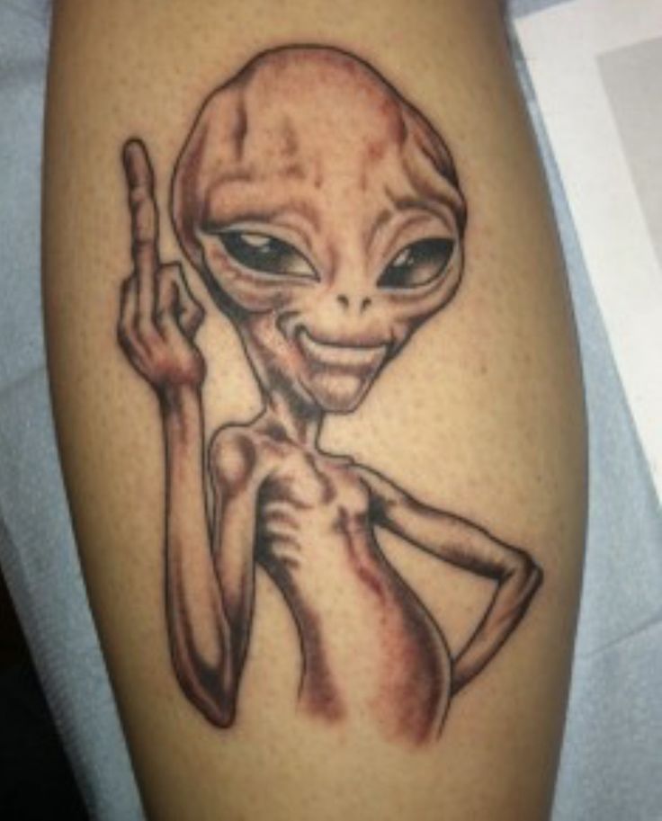 Black Ink Alien Tattoo On Leg Calf