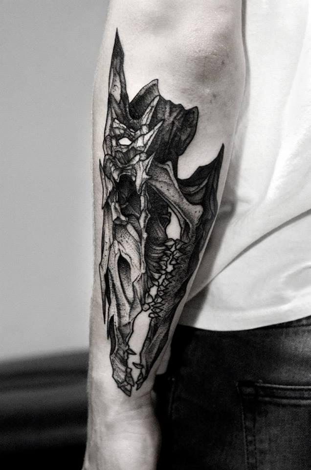 Black Ink Animal Skull Tattoo On Left Arm By Bartosz Wojda