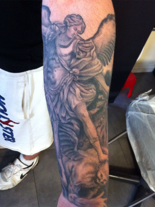 Black Ink Archangel Michael Tattoo On Left Forearm