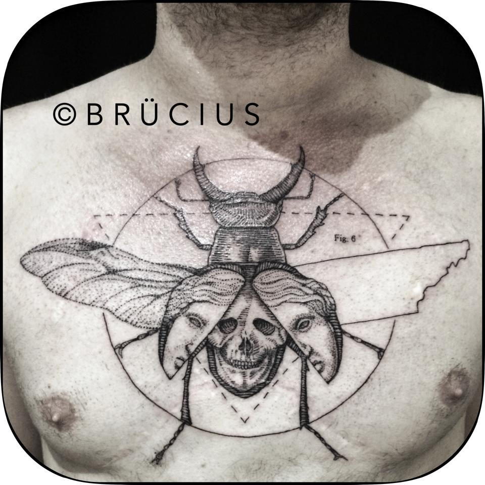 Black Ink Beetle Tattoo On Man Chest By Brucius