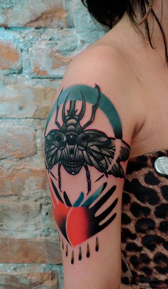 Black Ink Beetle Tattoo On Women Right Shoulder