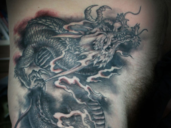 Black Ink Chinese Dragon Tattoo On Left Side Rib