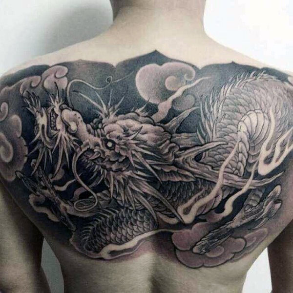 Black Ink Chinese Dragon Tattoo On Man Upper Back