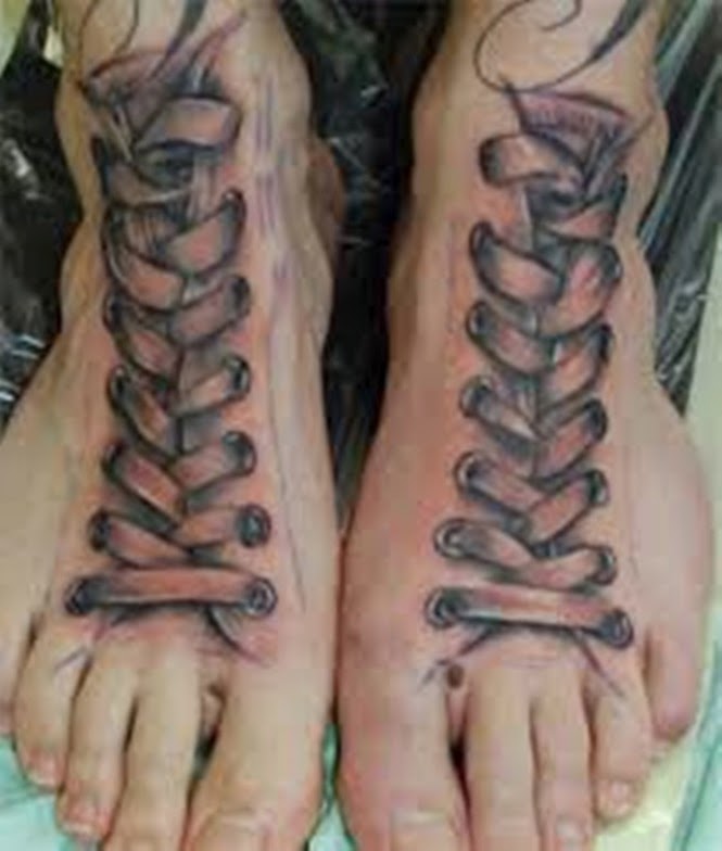 Black Ink Corset Tattoo On Feet