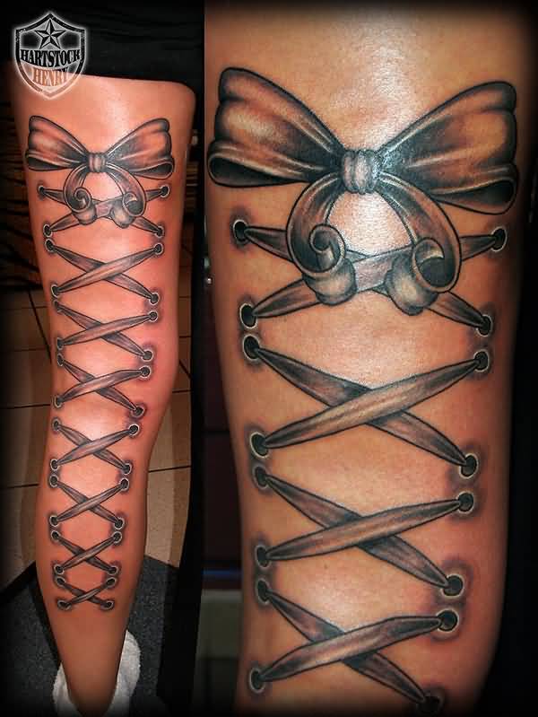 Black Ink Corset With Bow Tattoo On Right Full Back Leg