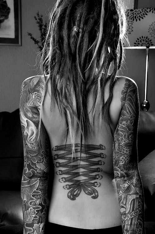 Black Ink Corset With Bow Tattoo On Women Back