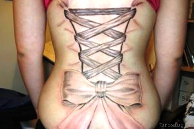 Black Ink Corset With Bow Tattoo On Women Lower Back