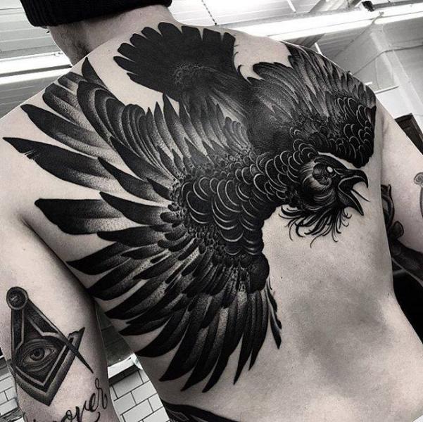 Black Ink Crow Tattoo On Man Full Back